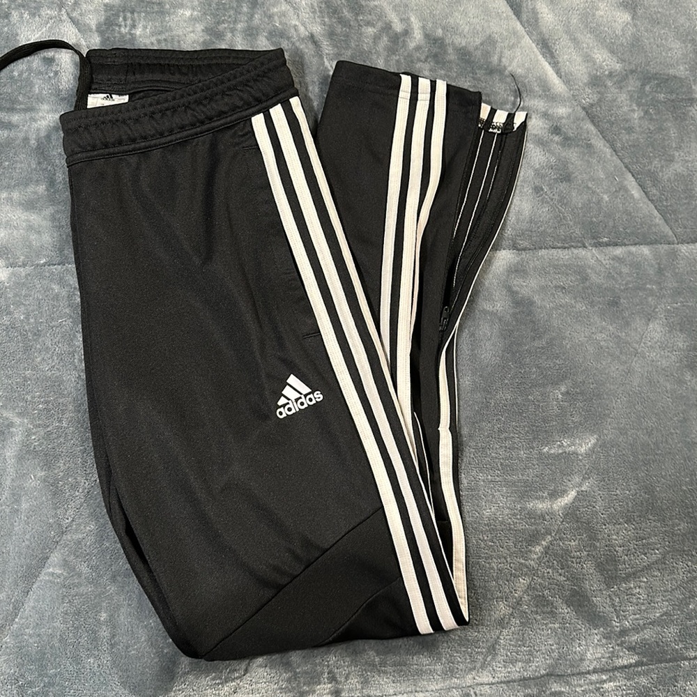 Women’s Adidas track pants. Original style with 3 white leg stripes and zip hem